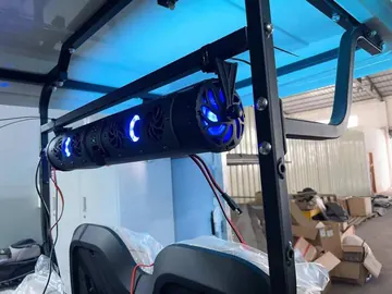 Soundbar music system mounted on a golf cart roof frame